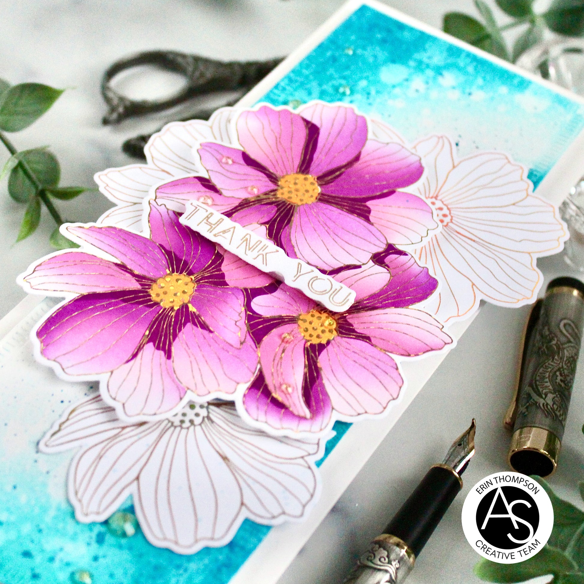 Floral card with 'Thank You' message on a blue background, featuring a pen and ink bottle. alex-syberia-designs best uk cardmaking brand papercrafting better-press-plate spellbinders