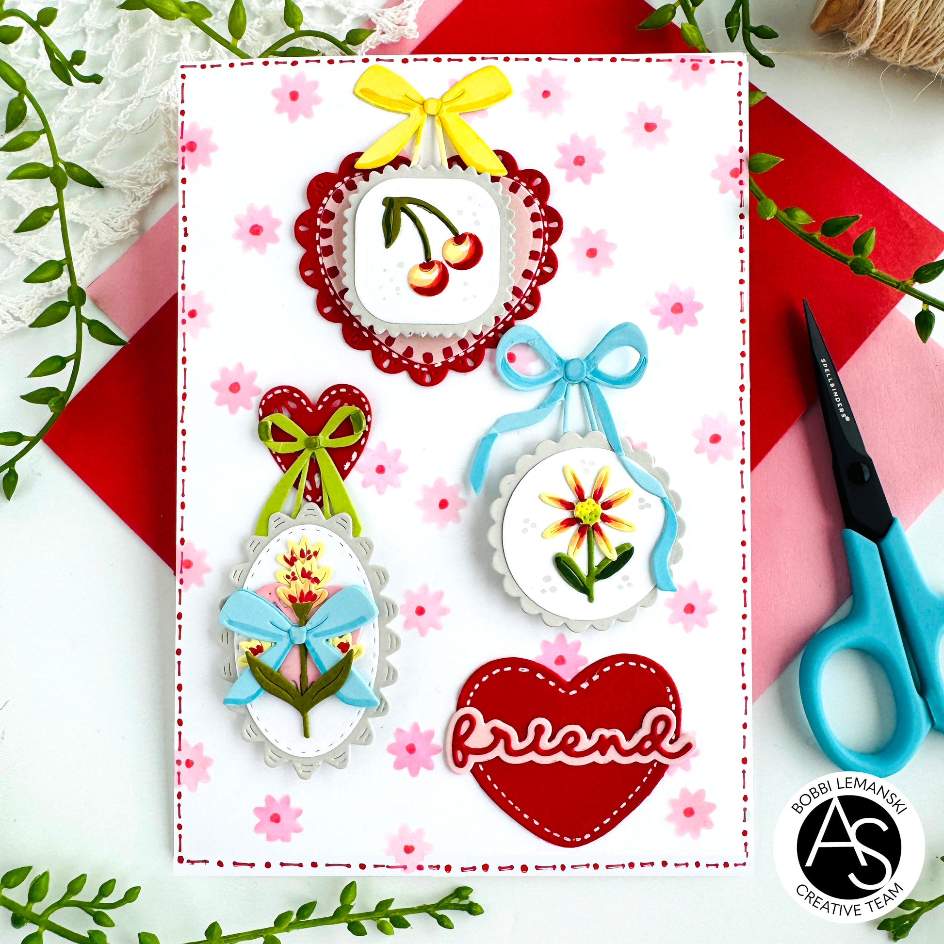 Decorative card with embroidered designs and 'friend' text, featuring Alex Syberia Designs medallions on a floral background.